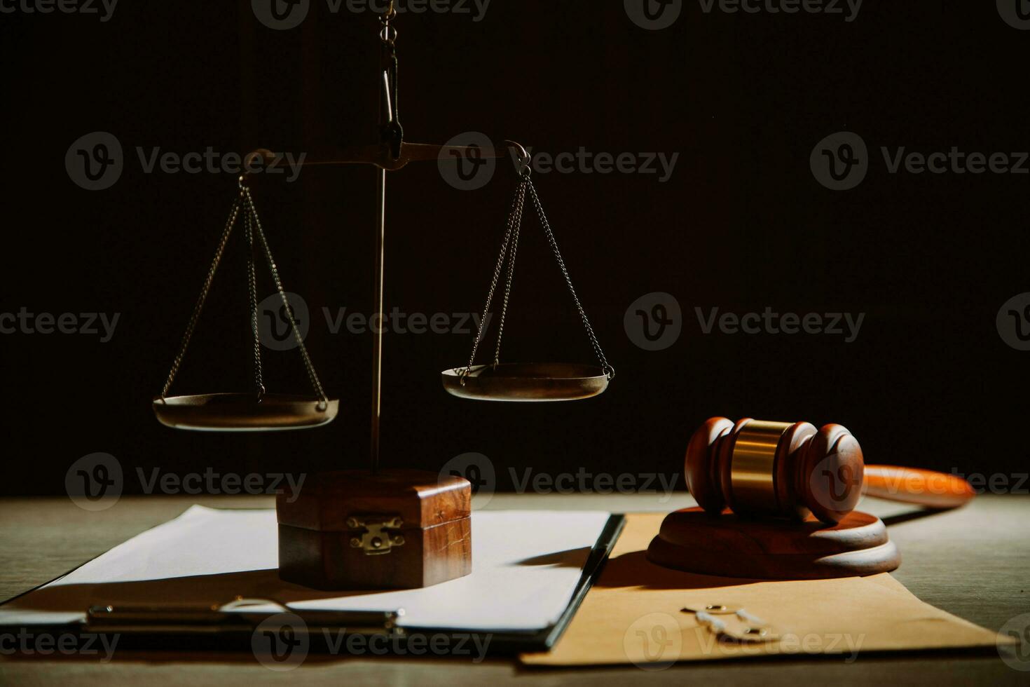 law legal technology concept. judge gavel on computer with scales of justice on desk of lawyer. photo