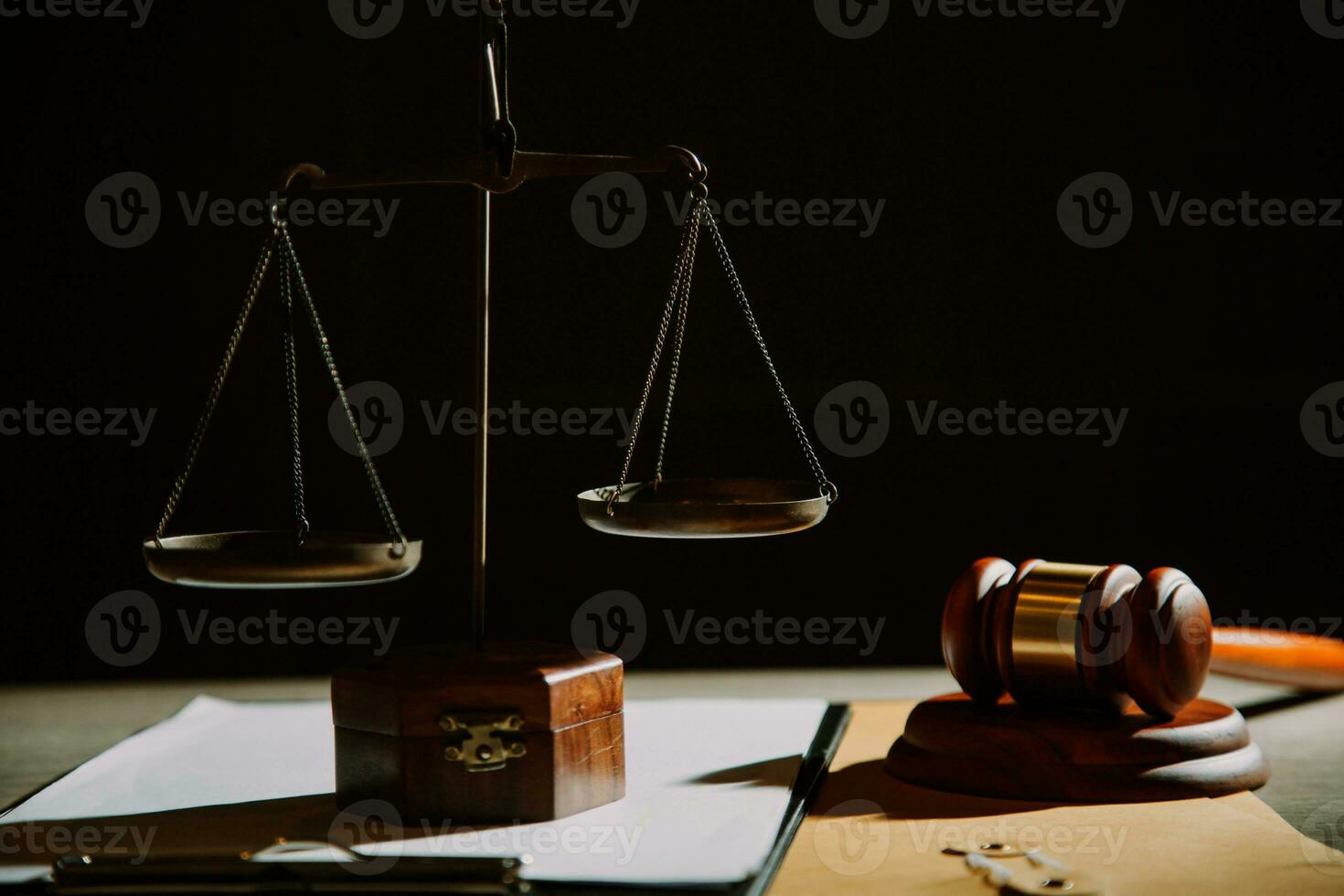 law legal technology concept. judge gavel on computer with scales of justice on desk of lawyer. photo
