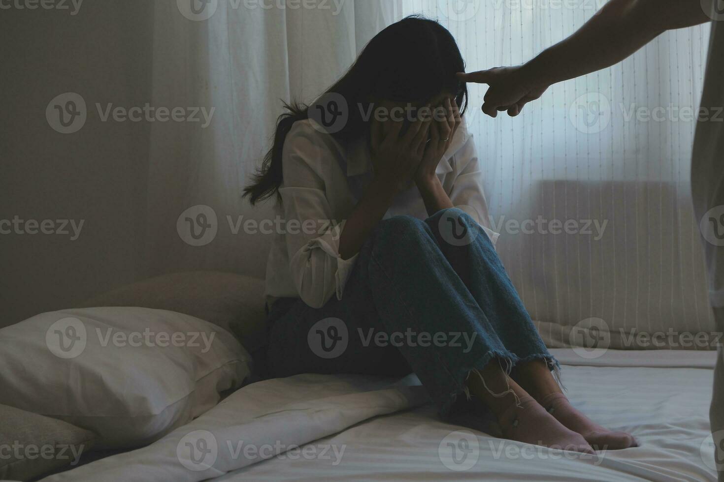 Upset woman having a fight with a man at home. Hispanic wife slapping the face of her husband during an argument because of their relationship problems photo