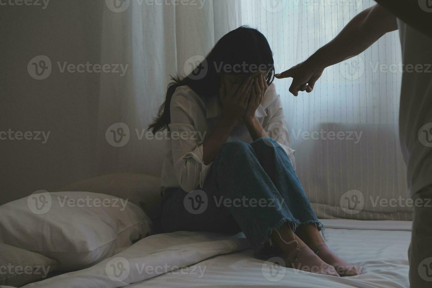 Upset woman having a fight with a man at home. Hispanic wife slapping the face of her husband during an argument because of their relationship problems photo