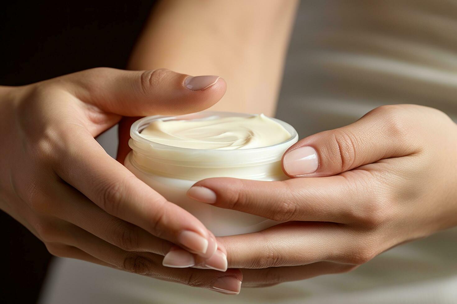 woman applying cream on her hands photo