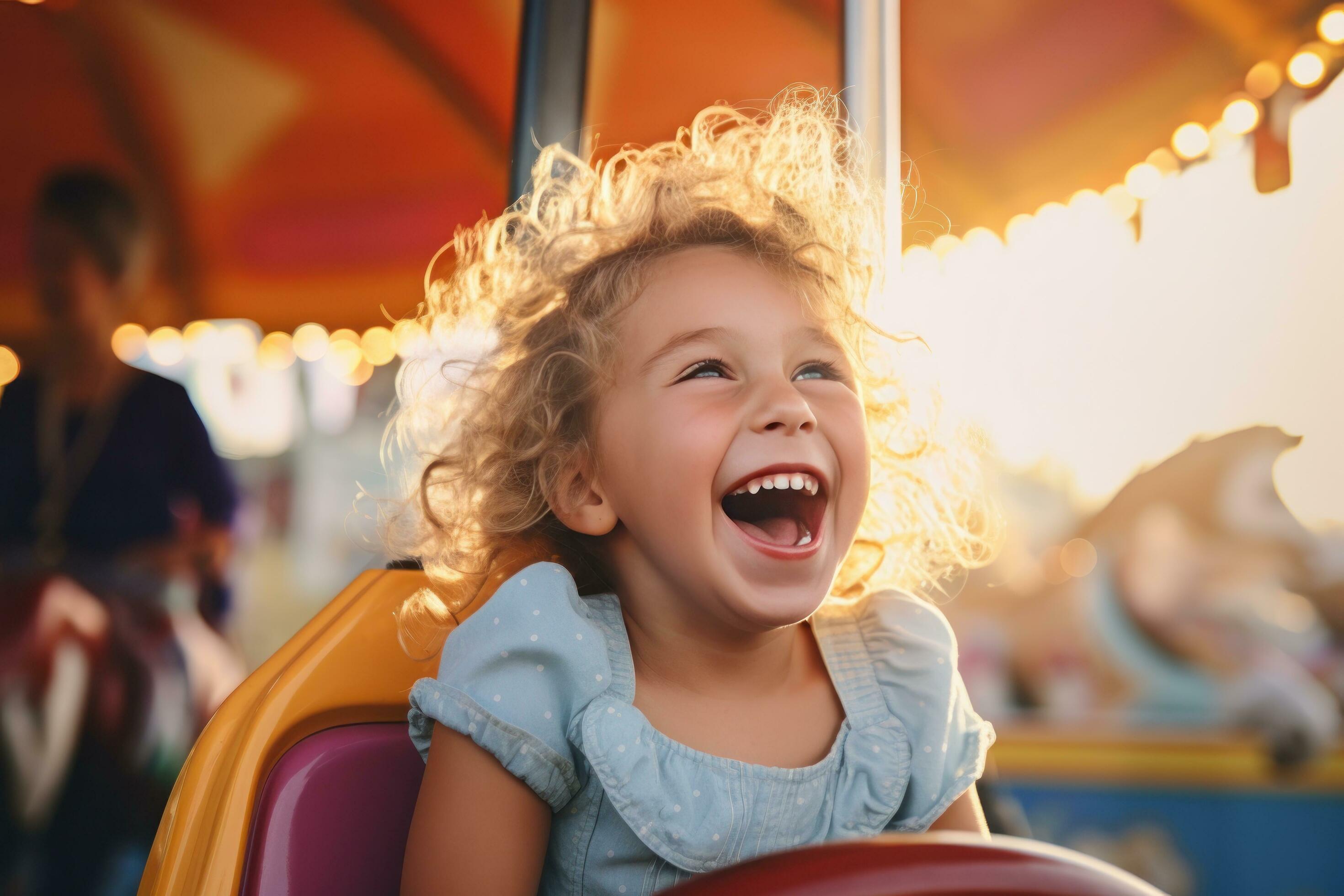 Cute little girl laughing at carnival ride 29562016 Stock Photo at Vecteezy