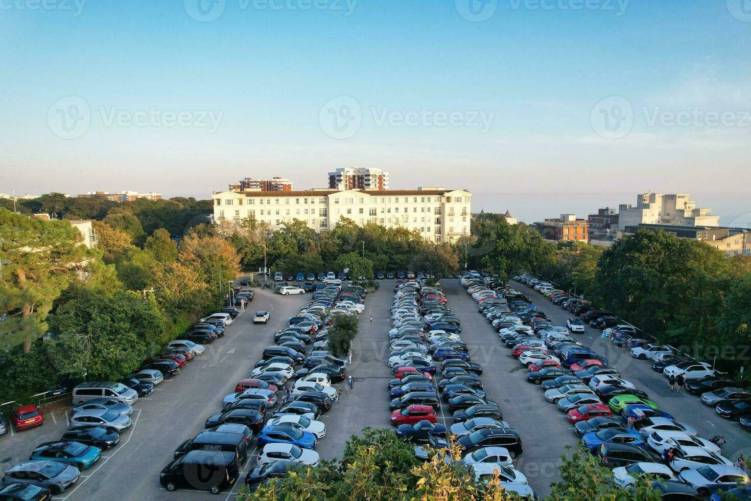 Aerial View of British Tourist Attraction of Bournemouth Beach and Sea view City of England Great Britain UK. Image Captured with Drone's Camera on September 9th, 2023 During Sunset photo