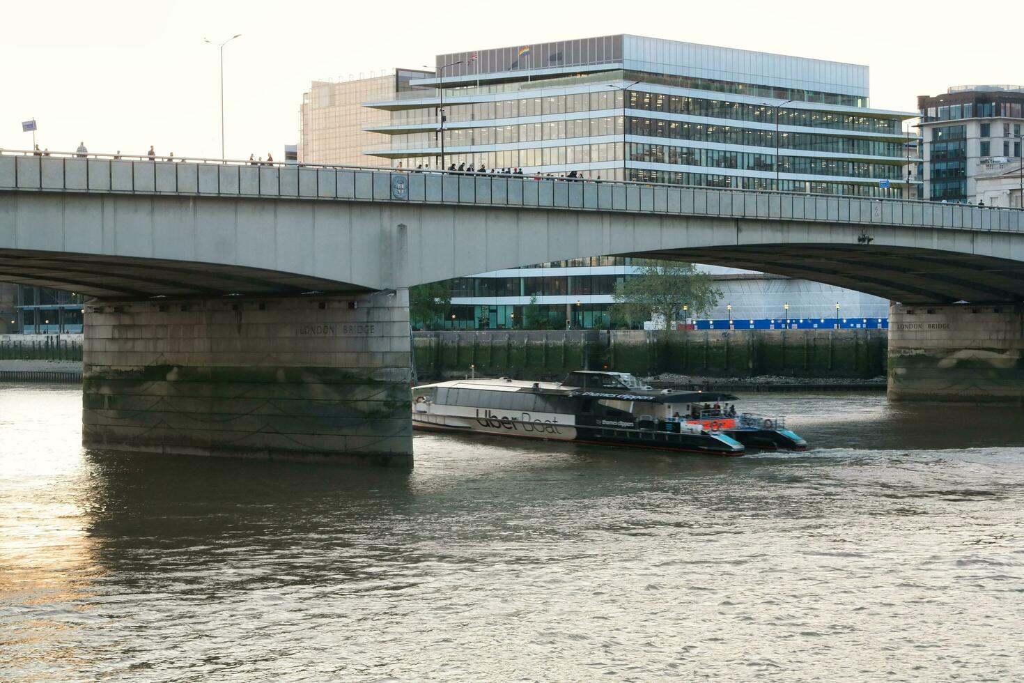 Best View of Boat over River Thames Waters at London Bridge, Capital City of England Great Britain. The Image Was Captured June 4th, 2023 photo