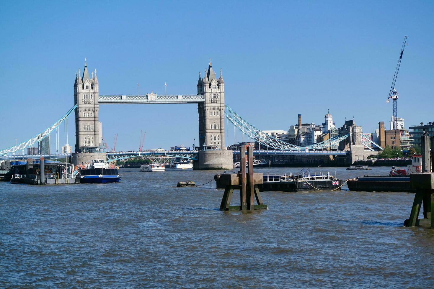 Best View of Boat over River Thames Waters at London Bridge, Capital City of England Great Britain. The Image Was Captured June 4th, 2023 photo