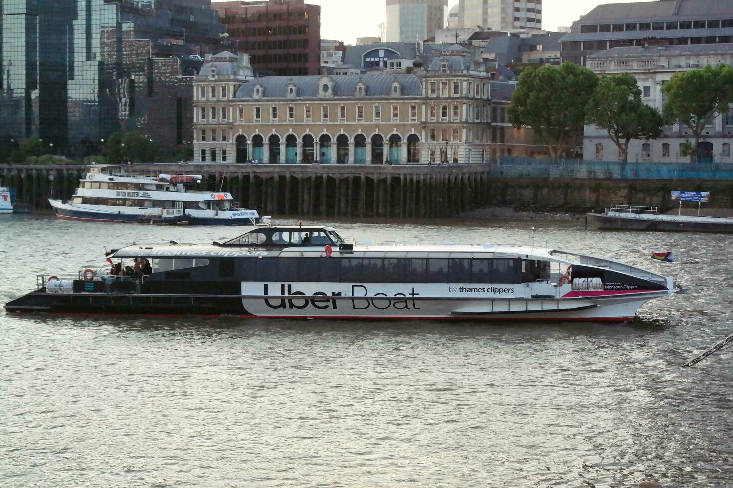 Best View of Boat over River Thames Waters at London Bridge, Capital City of England Great Britain. The Image Was Captured June 4th, 2023 photo