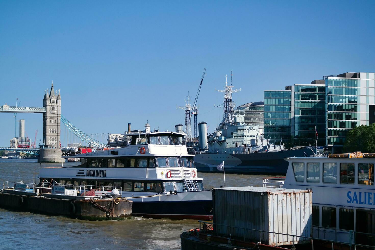 Best View of Boat over River Thames Waters at London Bridge, Capital City of England Great Britain. The Image Was Captured June 4th, 2023 photo