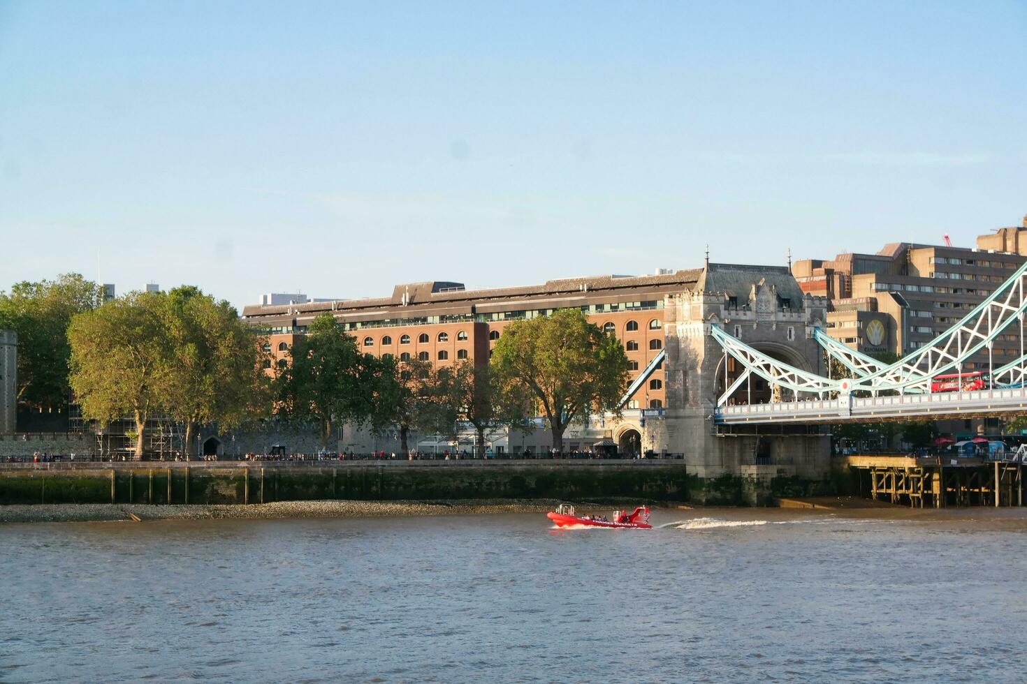Best View of Boat over River Thames Waters at London Bridge, Capital City of England Great Britain. The Image Was Captured June 4th, 2023 photo