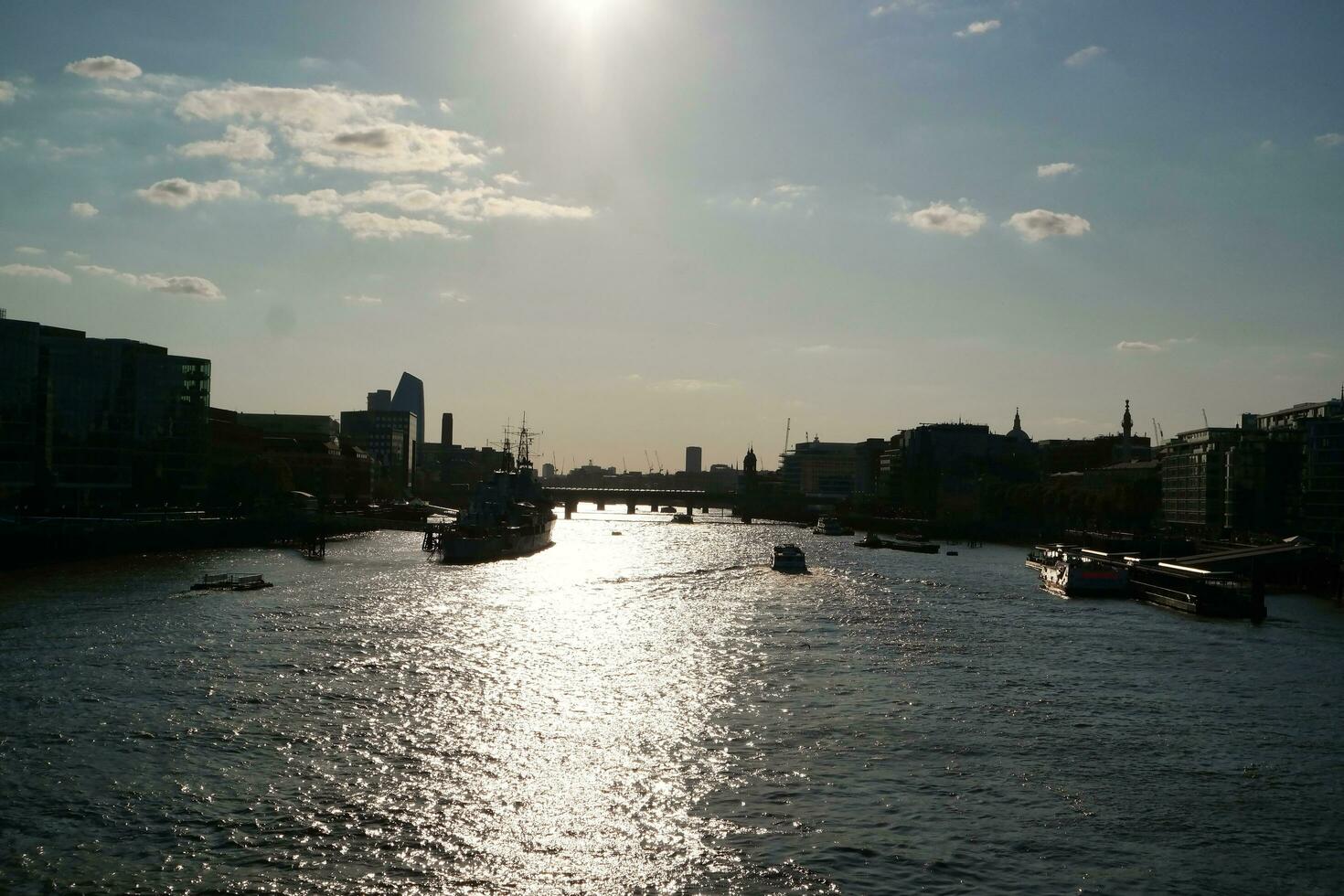 Best View of Boat over River Thames Waters at London Bridge, Capital City of England Great Britain. The Image Was Captured June 4th, 2023 photo