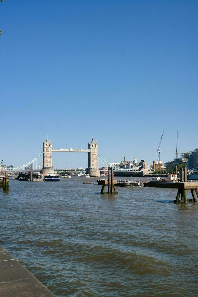 Best View of Boat over River Thames Waters at London Bridge, Capital City of England Great Britain. The Image Was Captured June 4th, 2023 photo