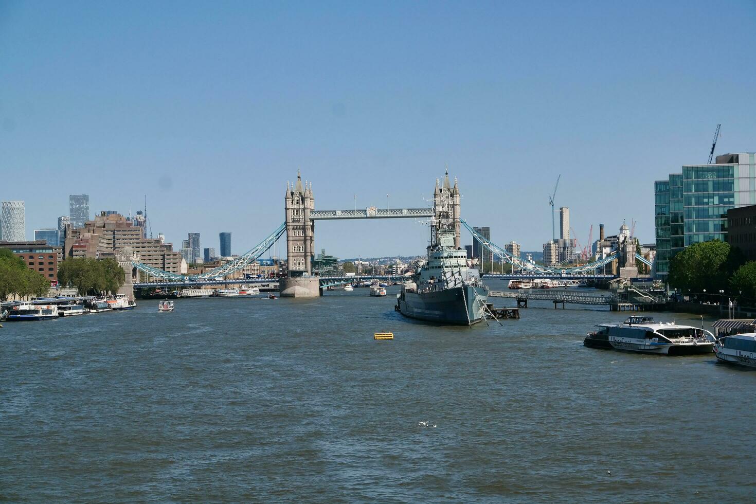 Best View of Boat over River Thames Waters at London Bridge, Capital City of England Great Britain. The Image Was Captured June 4th, 2023 photo