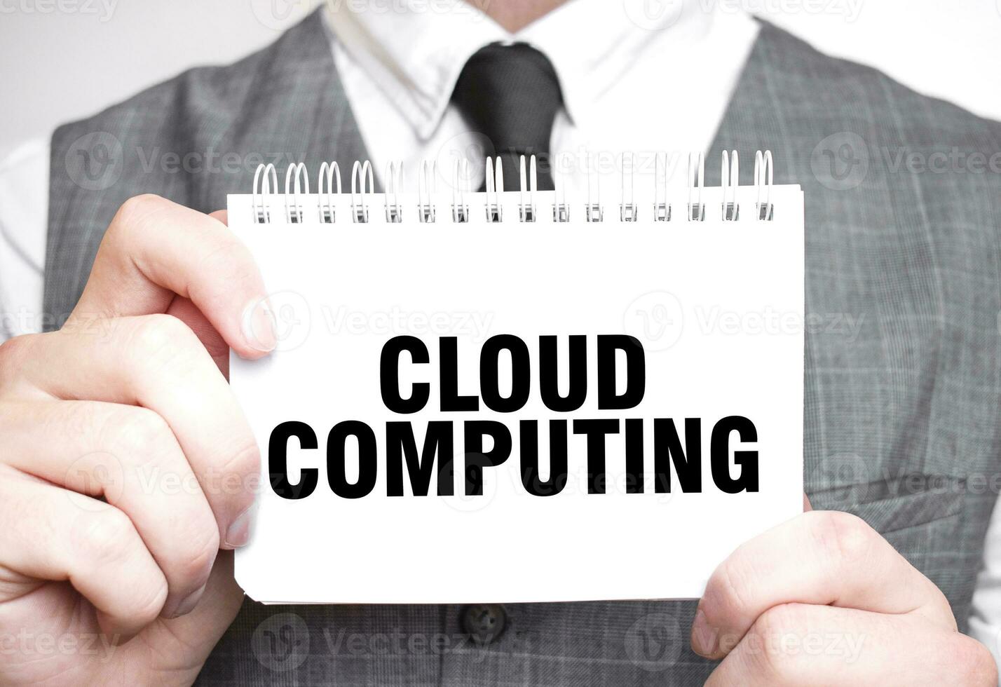 Businessman with notebook with text CLOUD COMPUTING photo