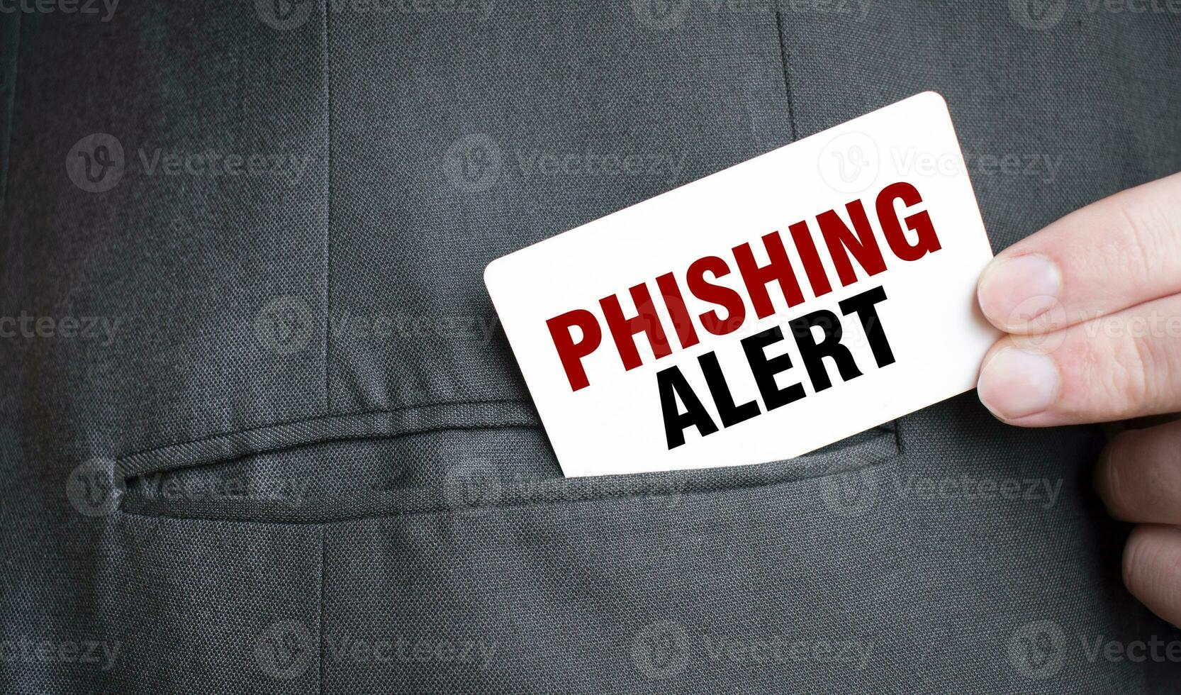 Card with PHISHING ALERT text in pocket of businessman suit. Investment and decisions business concept. photo