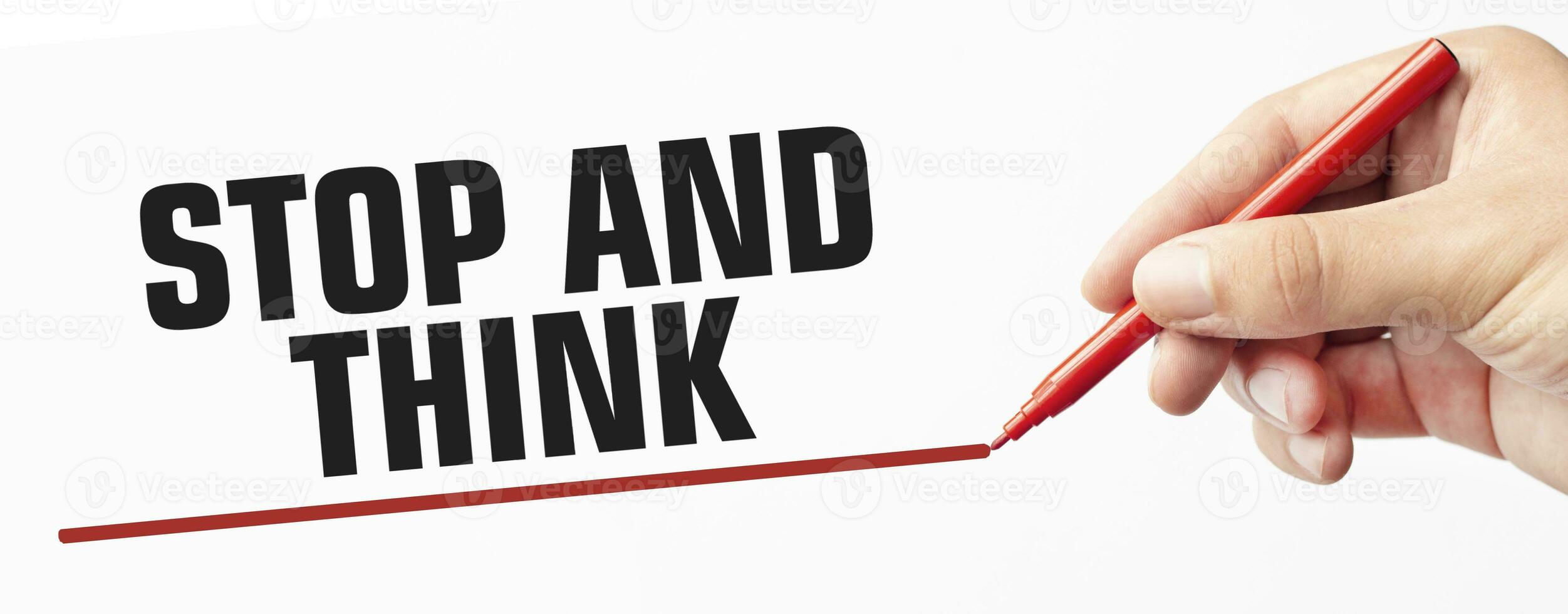 STOP AND THINK made with marker and hand on white background photo