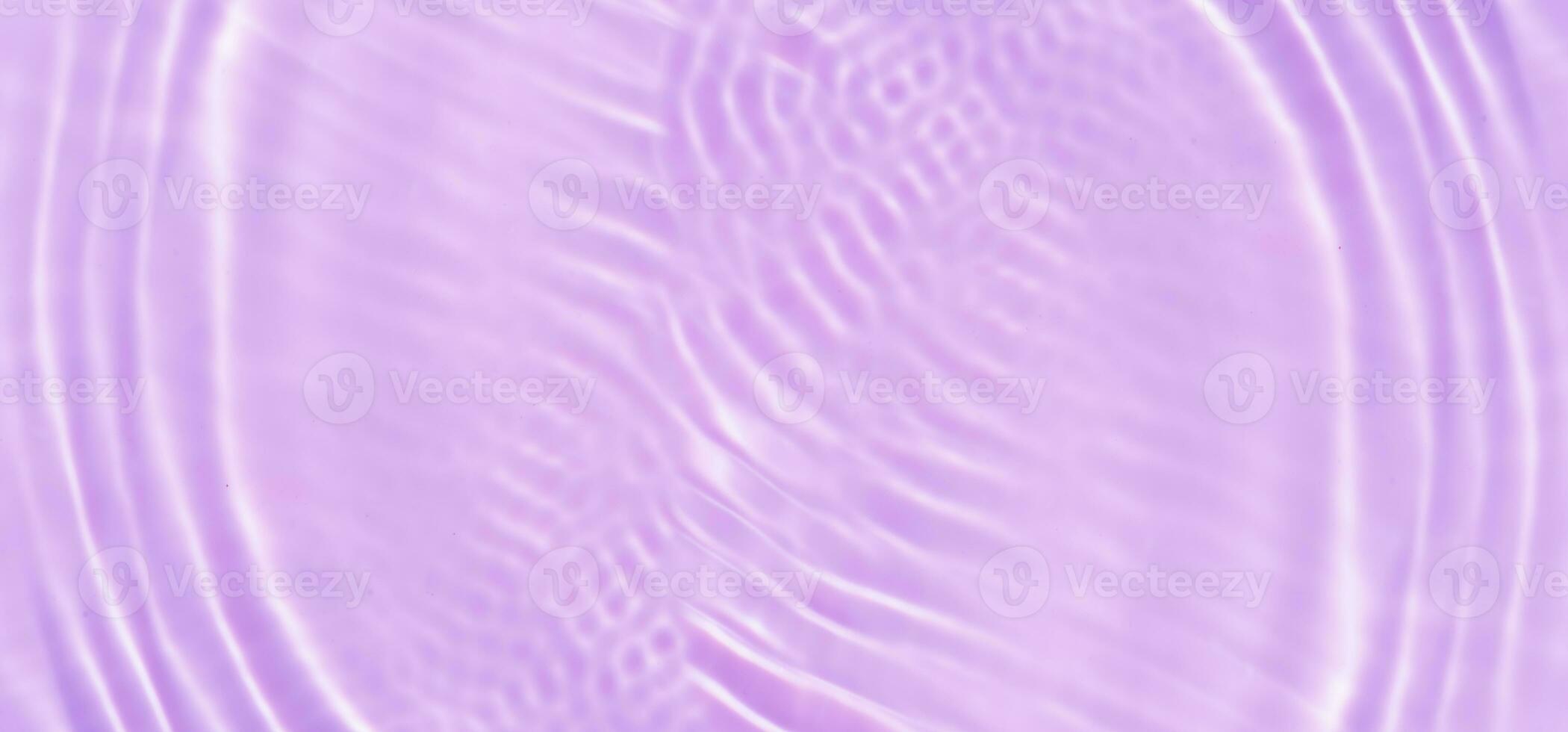 Blue water with ripples on the surface. Defocus blurred transparent blue colored clear calm water surface texture with splashes and bubbles. Water waves with shining pattern texture background. photo