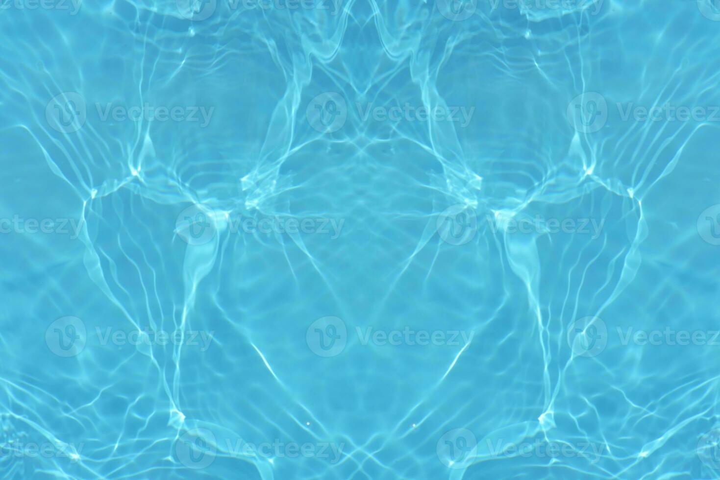 Blue water with ripples on the surface. Defocus blurred transparent blue colored clear calm water surface texture with splashes and bubbles. Water waves with shining pattern texture background. photo