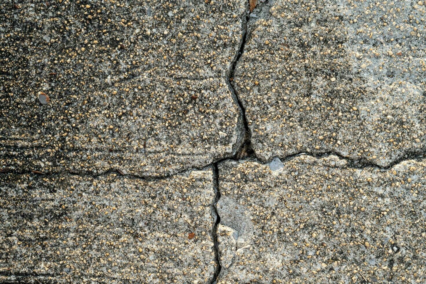 Cracked old concrete floor used for concrete background texture in decorative art work. photo