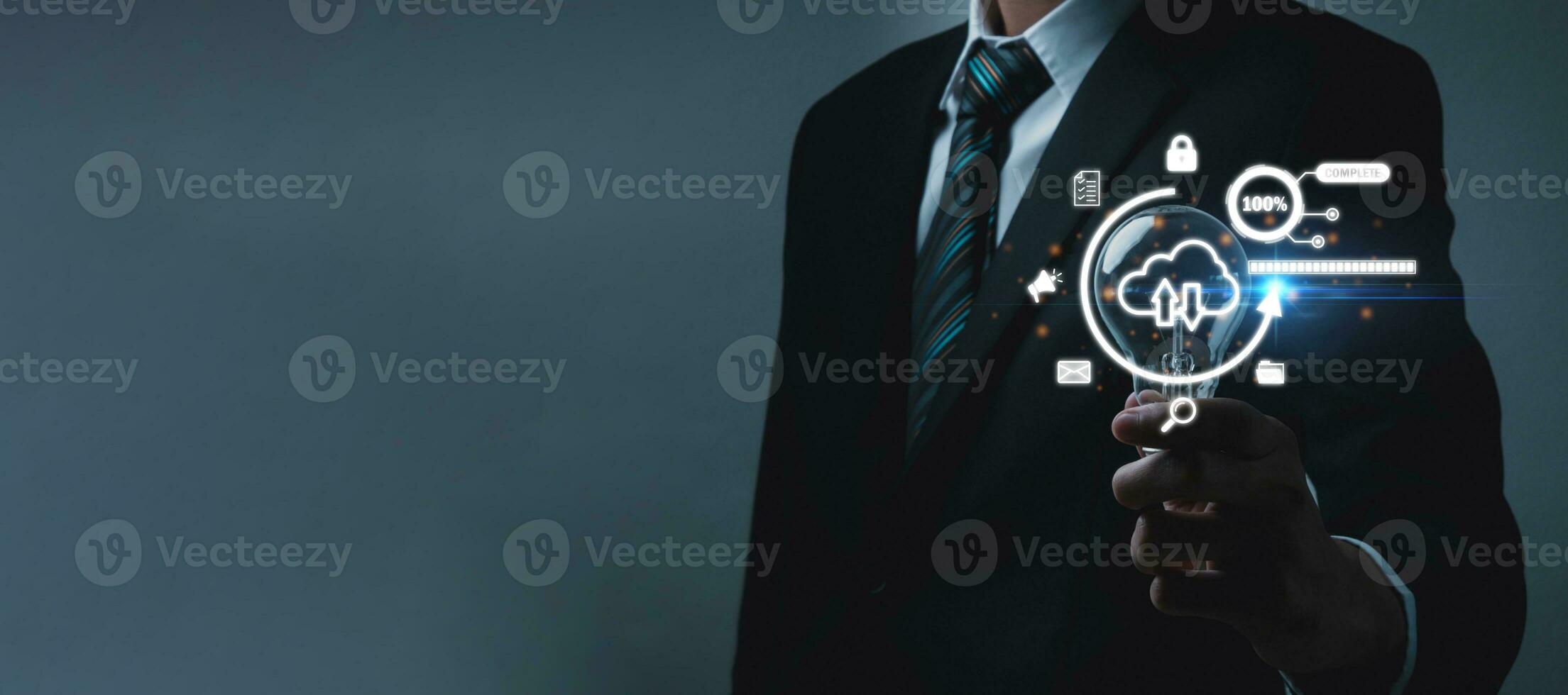 Cloud Computing Technology. businessman investor hand holding light bulb with cyber security graphic icon diagram, internet security, business finance, digital marketing, file data transfer concept photo