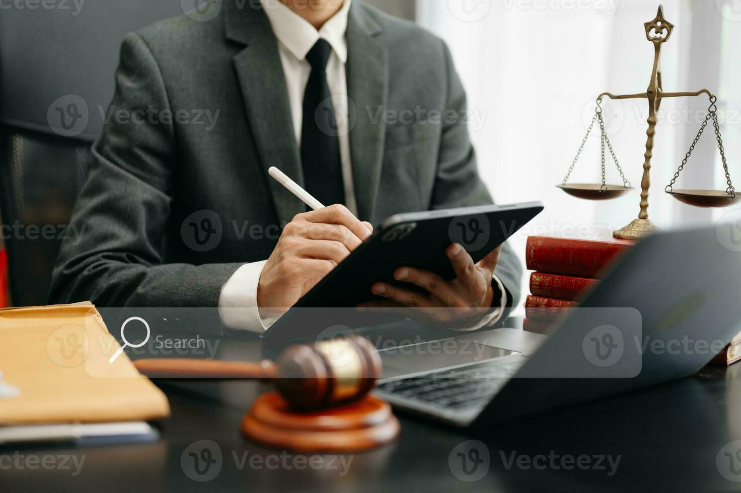 Searching Browsing Internet Data Information Networking Concept with blank search bar.justice and law concept.Male judge in a courtroom with the gavel,working with digital tablet photo