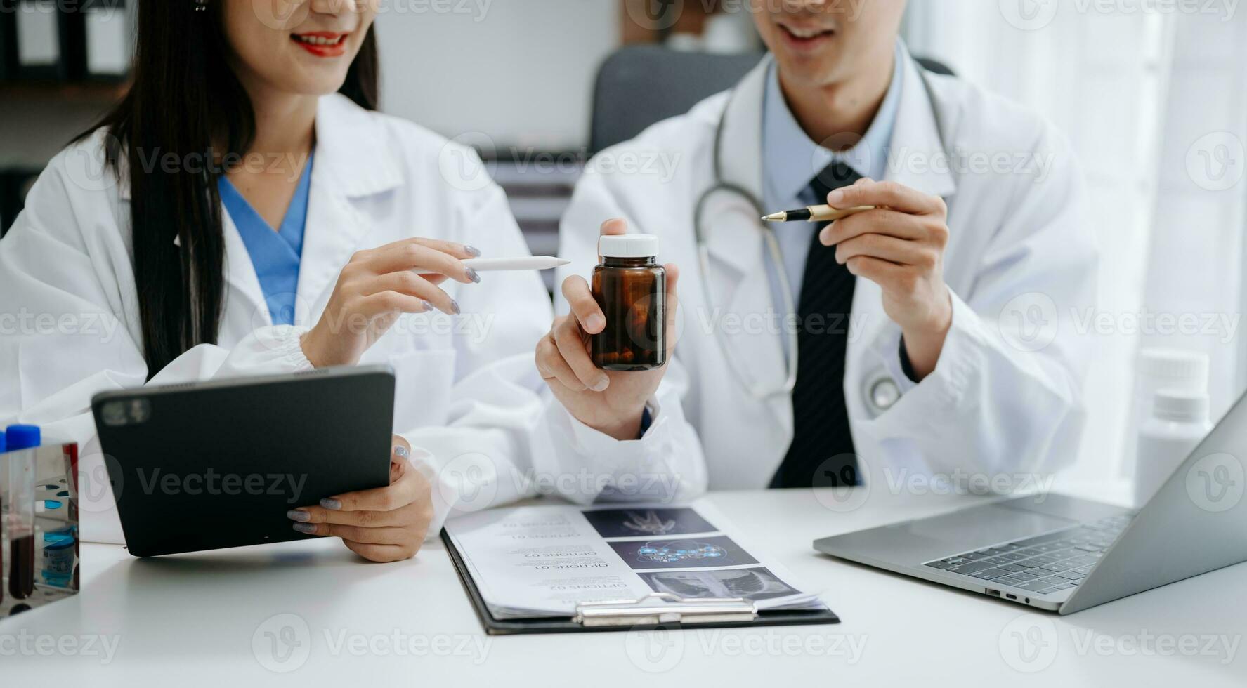 Medical technology network team meeting concept. Doctor hand working with smart phone modern digital tablet and laptop computer with graphics chart interface, with virtual icon diagram photo