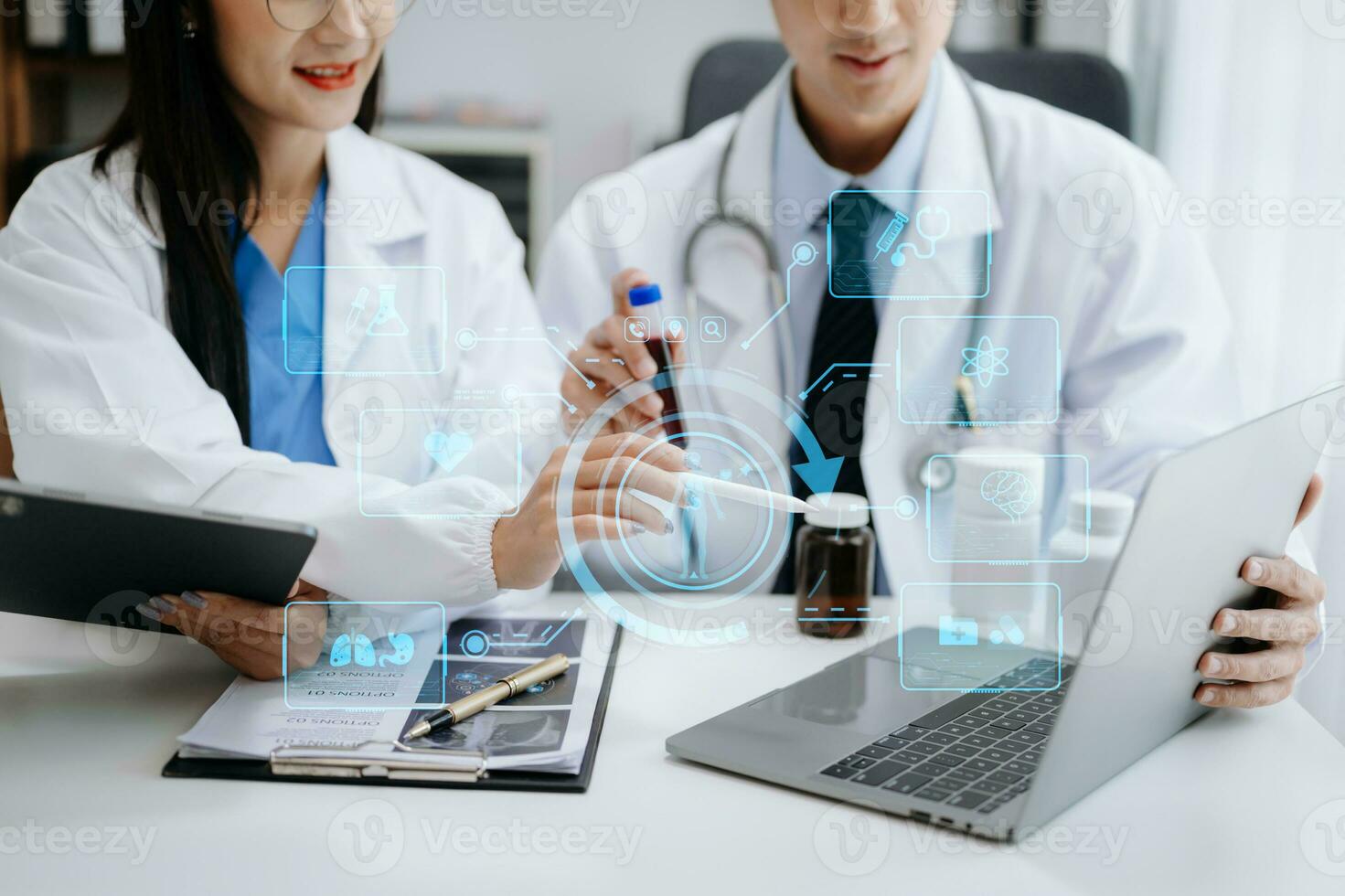 Medical technology network team meeting concept. Doctor hand working with smart phone modern digital tablet and laptop computer with graphics chart interface, with virtual icon diagram photo