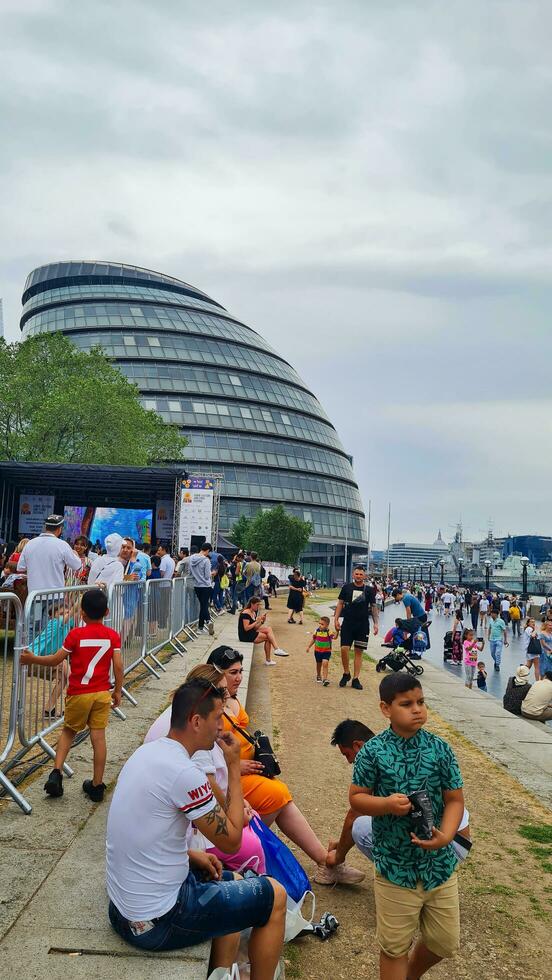 Low Angle View of World Famous Tourist Attraction at Tower Bridge and River Thames Which is Mostly Crowded with International Tourists at Central London, England UK. Captured on June, 18th 2023 photo