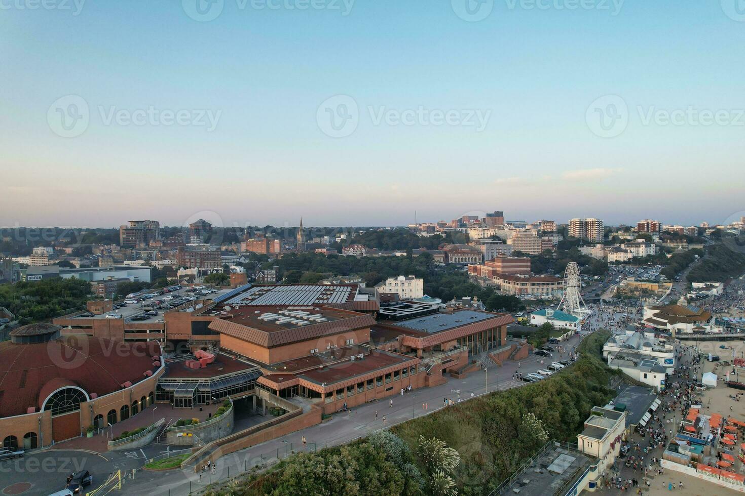 Aerial View of British Tourist Attraction of Bournemouth Beach and Sea view City of England Great Britain UK. Image Captured with Drone's Camera on September 9th, 2023 During Sunset photo