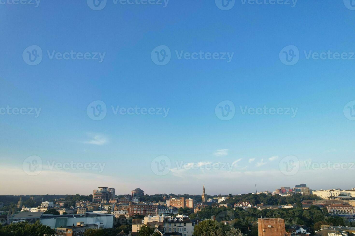 Aerial View of British Tourist Attraction of Bournemouth Beach and Sea view City of England Great Britain UK. Image Captured with Drone's Camera on September 9th, 2023 During Sunset photo