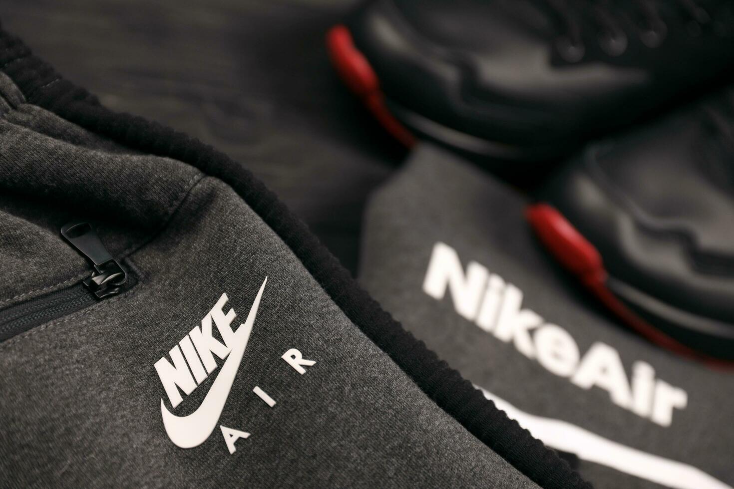 KHARKOV, UKRAINE - DECEMBER 20, 2020 Nike brand clothes and shoes sport wear kit. Nike is American multinational corporation engaged in manufacturing and worldwide marketing of clothes and footwear photo