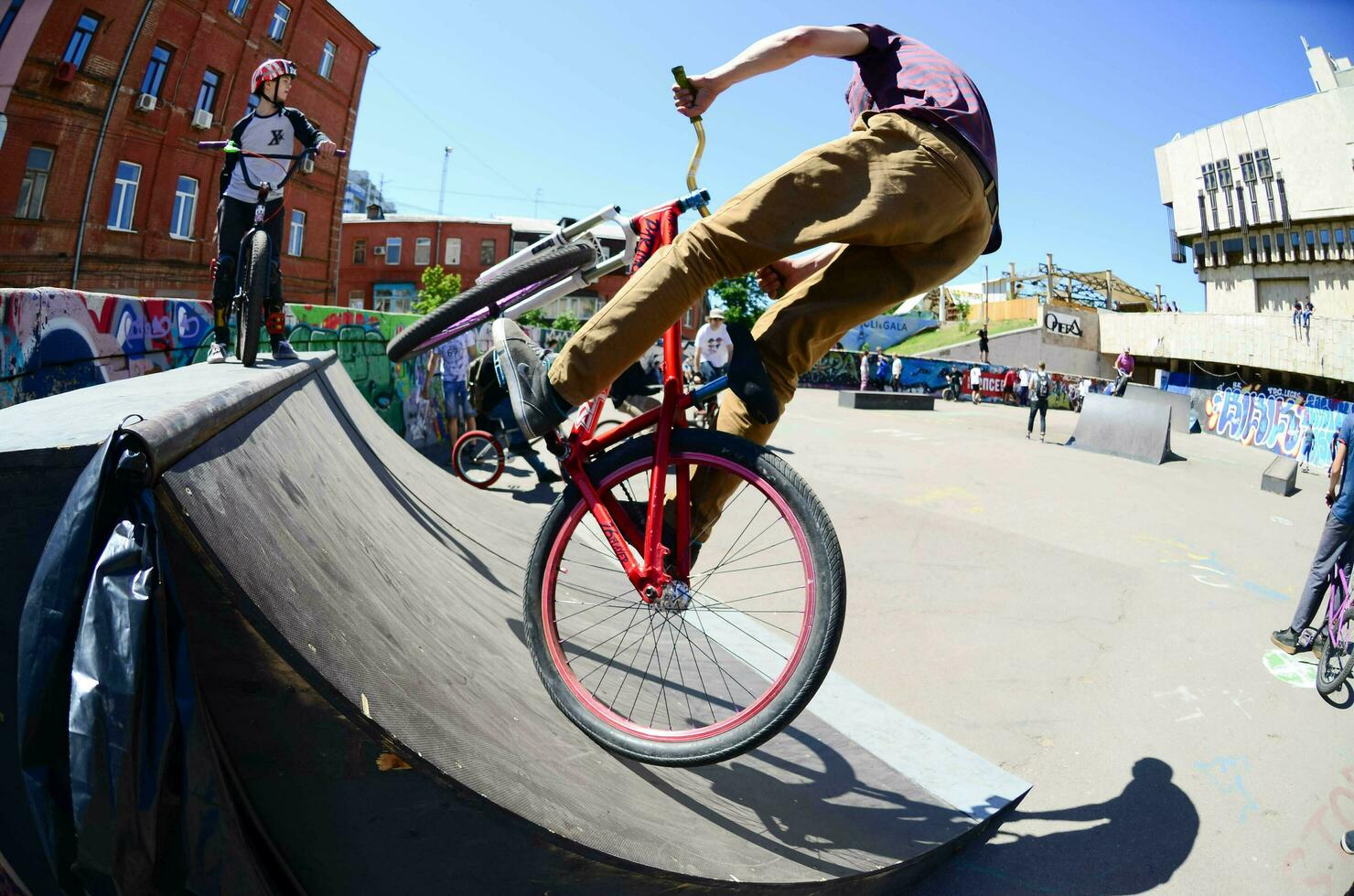 KHARKIV, UKRAINE - 27 MAY, 2018 Freestyle BMX riders in a skatepark during the annual festival of street cultures photo