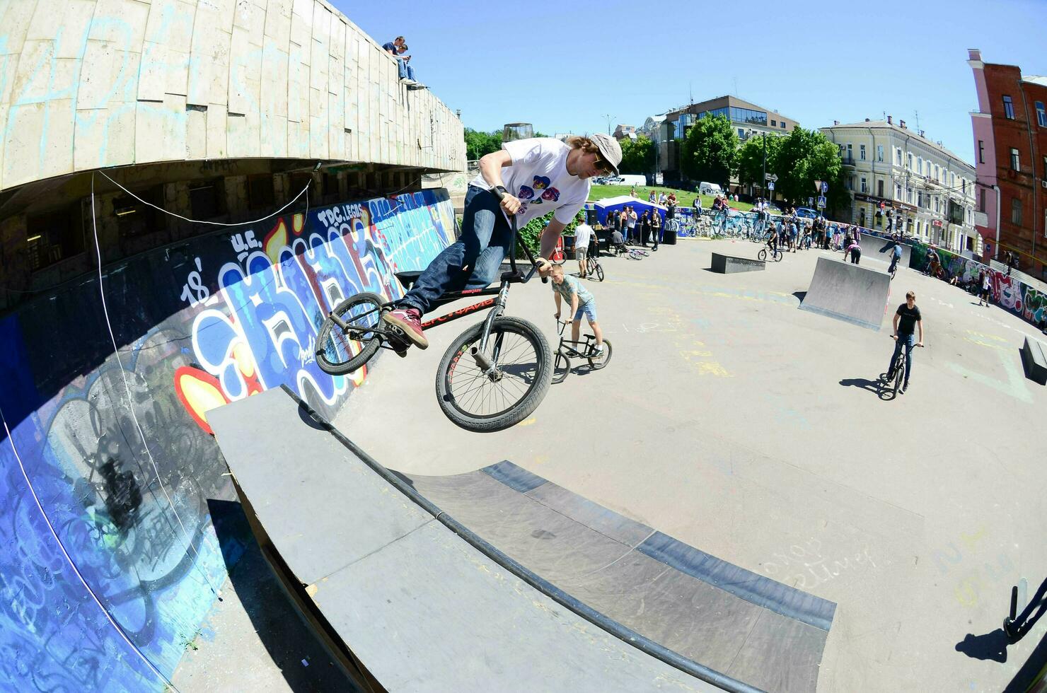 KHARKIV, UKRAINE - 27 MAY, 2018 Freestyle BMX riders in a skatepark during the annual festival of street cultures photo