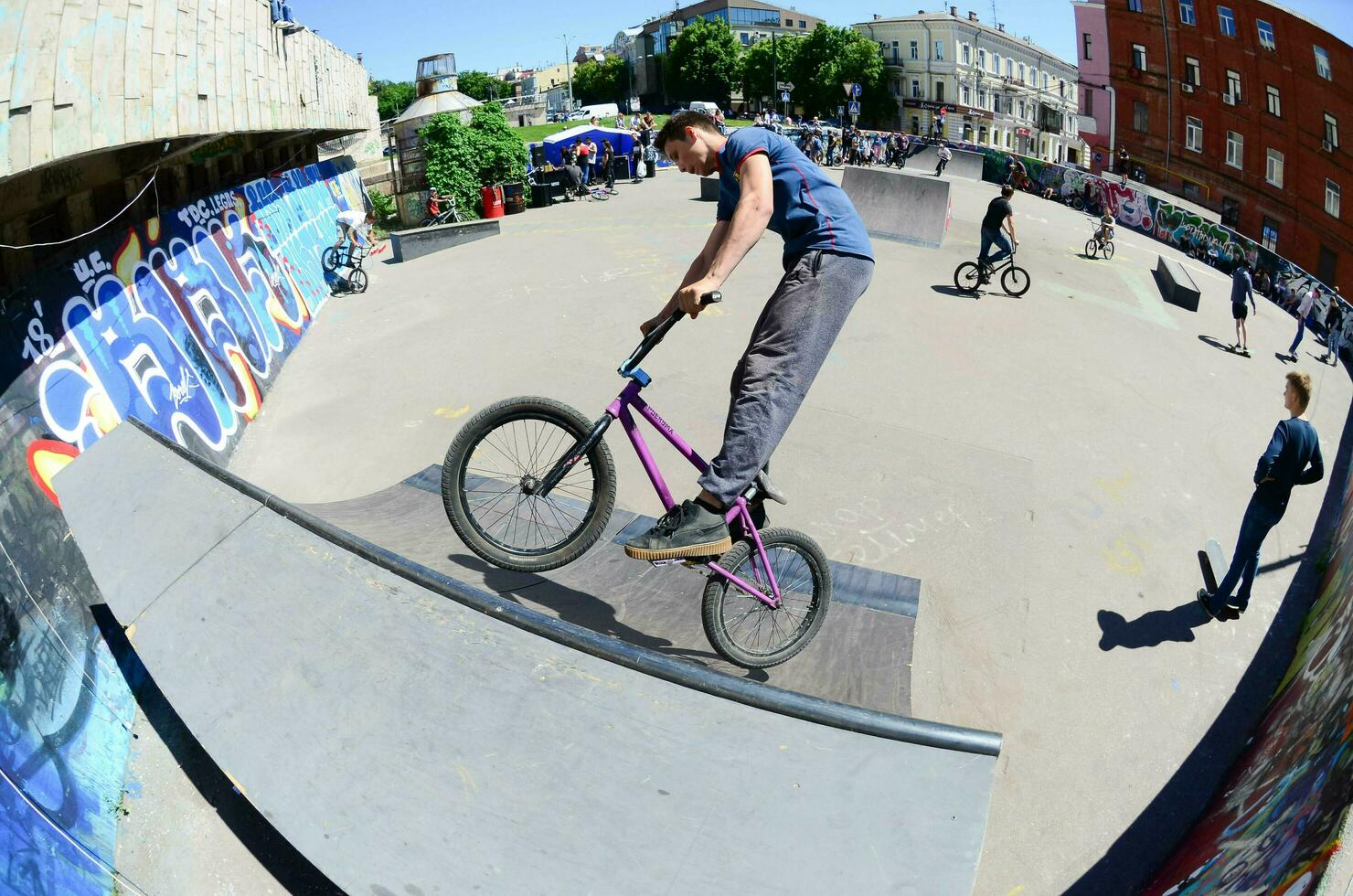 KHARKIV, UKRAINE - 27 MAY, 2018 Freestyle BMX riders in a skatepark during the annual festival of street cultures photo