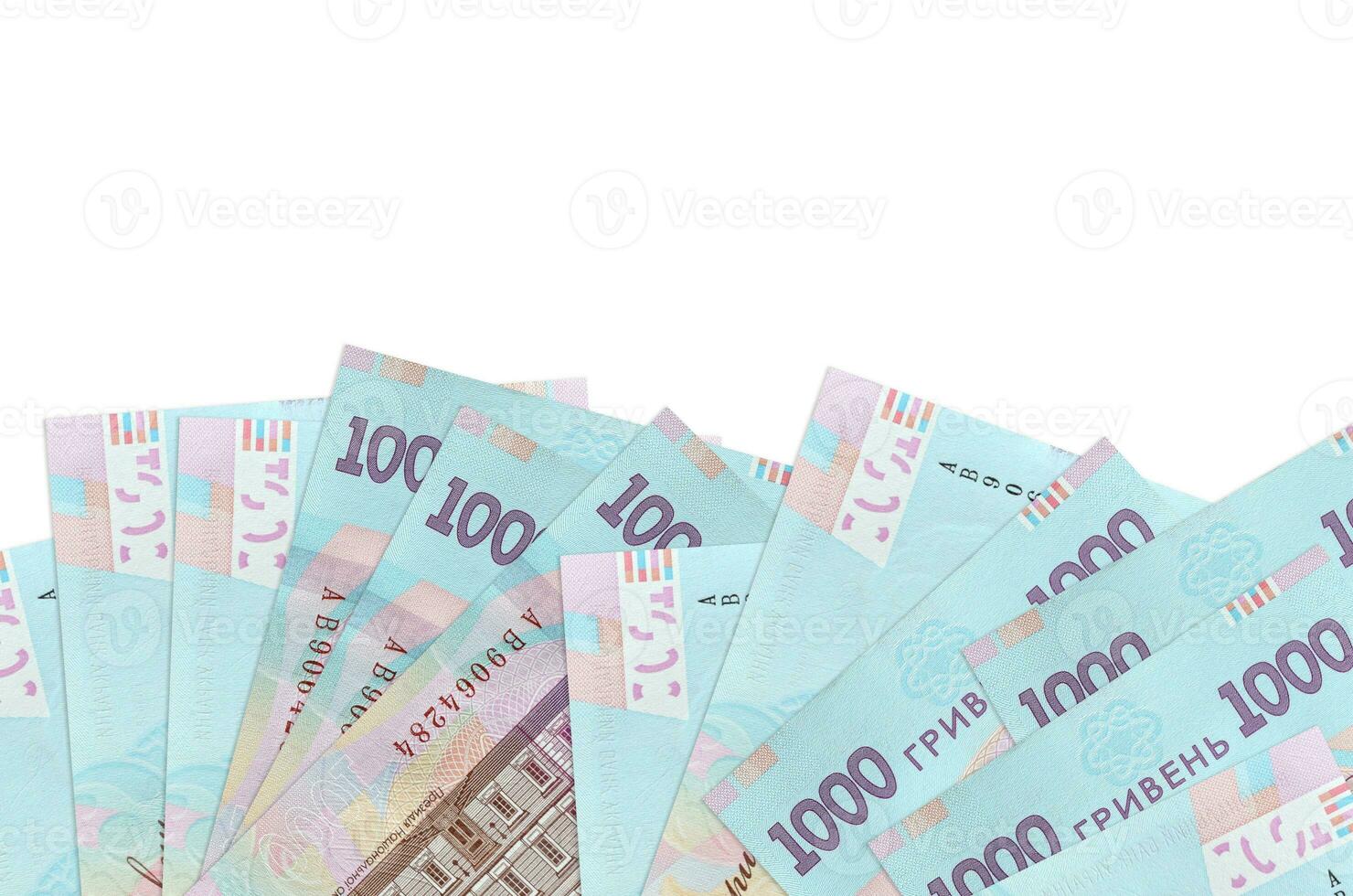 1000 Ukrainian hryvnias bills lies on bottom side of screen isolated on white background with copy space. Background banner template photo