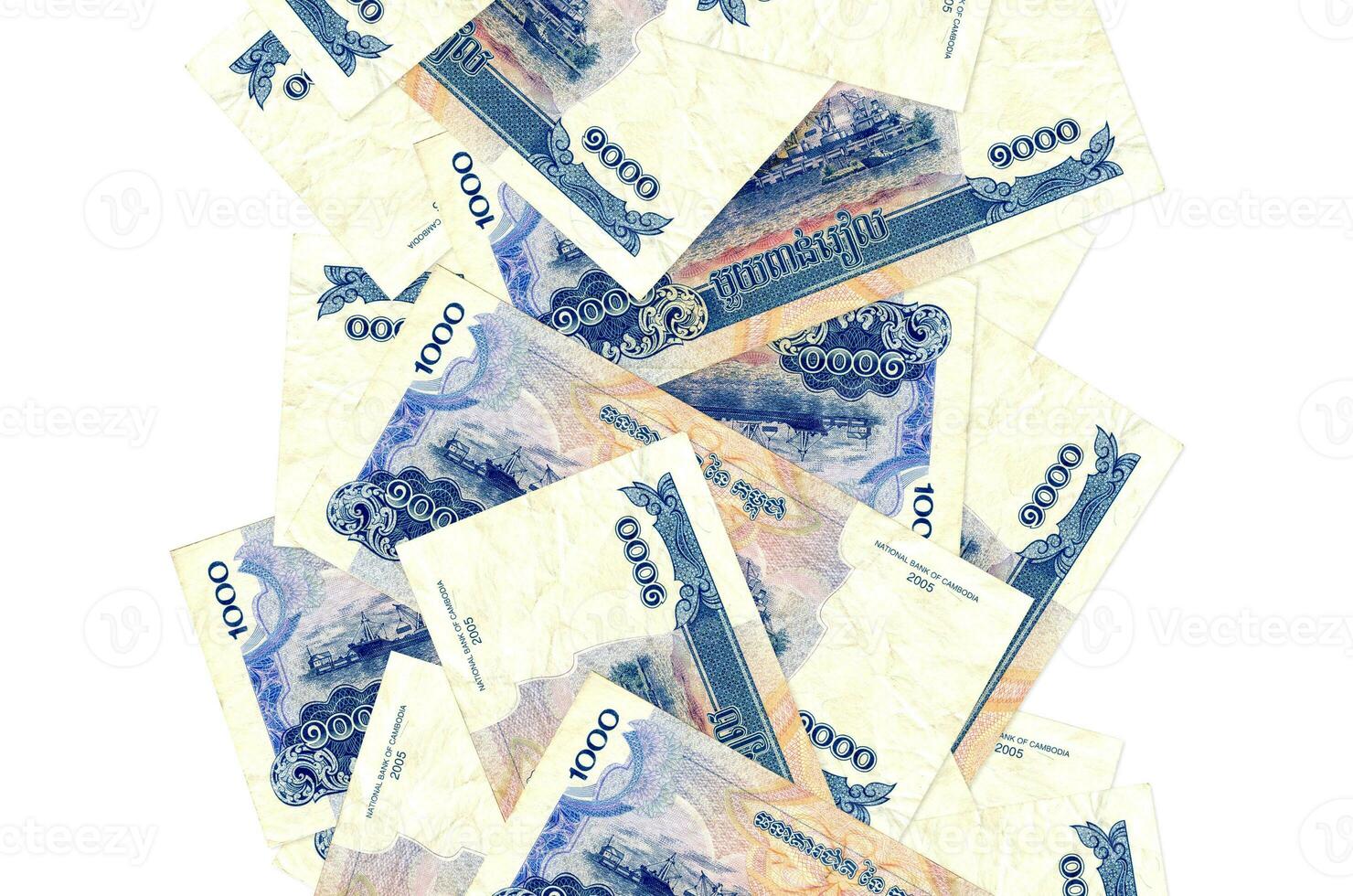 1000 Cambodian riels bills flying down isolated on white. Many banknotes falling with white copyspace on left and right side photo