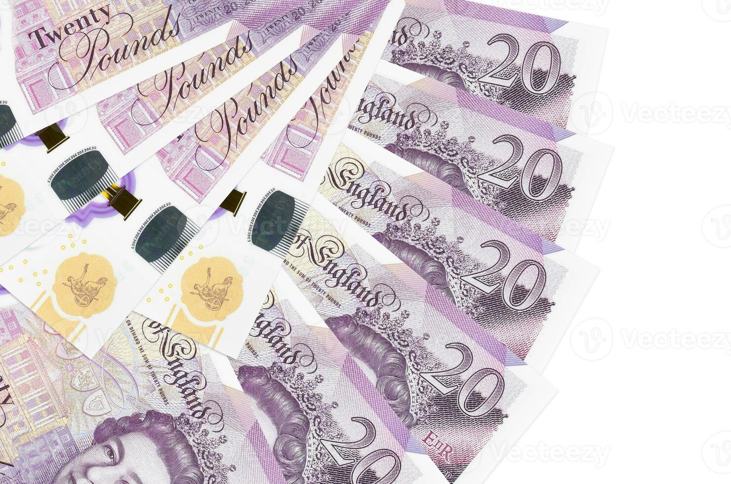 20 British pounds bills lies isolated on white background with copy space stacked in fan shape close up photo