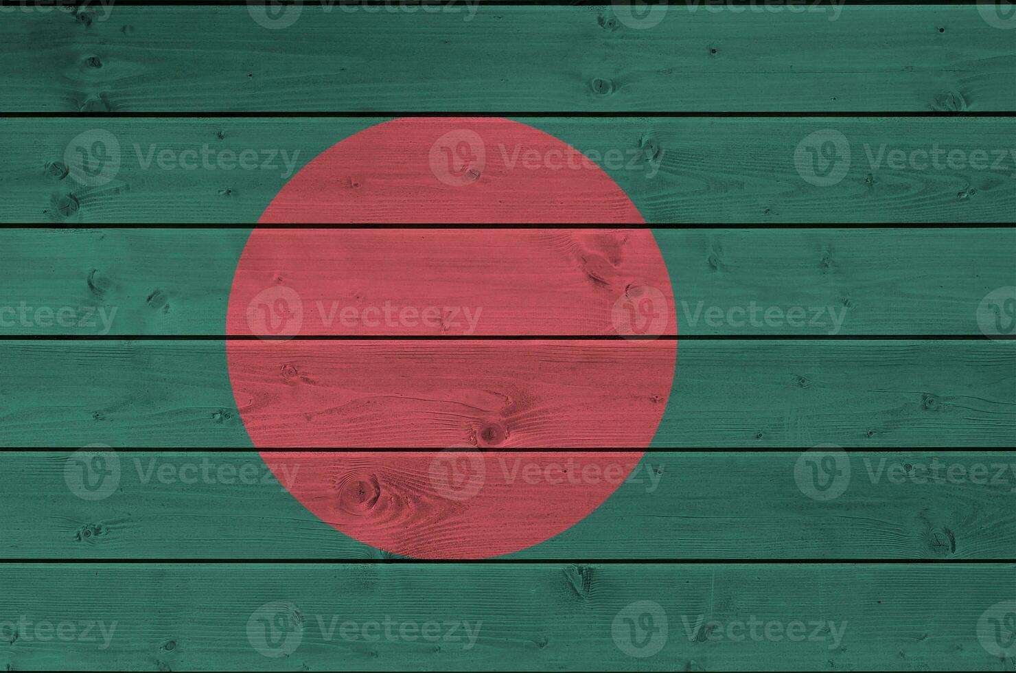 Bangladesh flag depicted in bright paint colors on old wooden wall. Textured banner on rough background photo