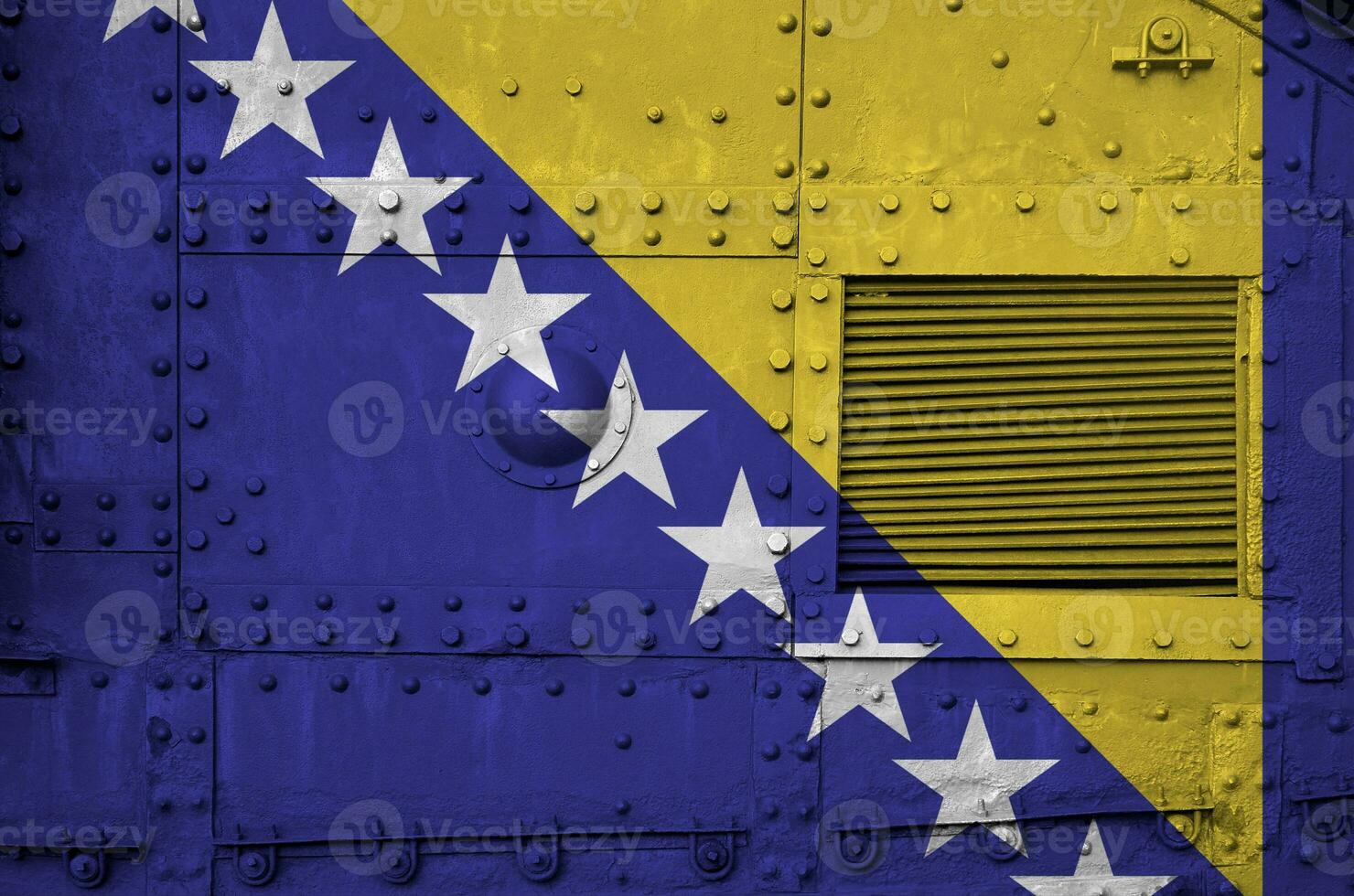 Bosnia and Herzegovina flag depicted on side part of military armored tank closeup. Army forces conceptual background photo