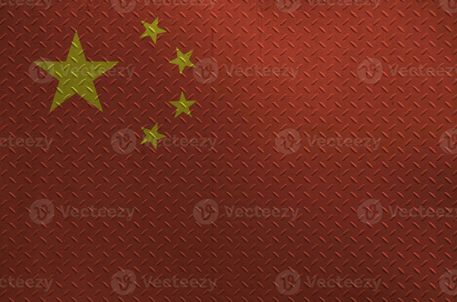 China flag depicted in paint colors on old brushed metal plate or wall closeup. Textured banner on rough background photo