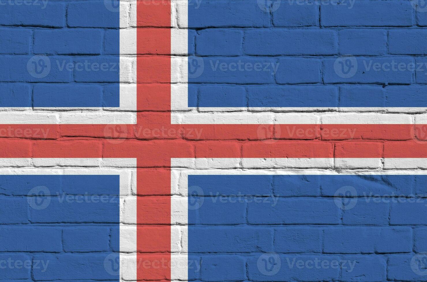 bandera de islandia representada en colores de pintura en la pared de ladrillo antiguo. banner texturizado sobre fondo de mampostería de pared de ladrillo grande foto