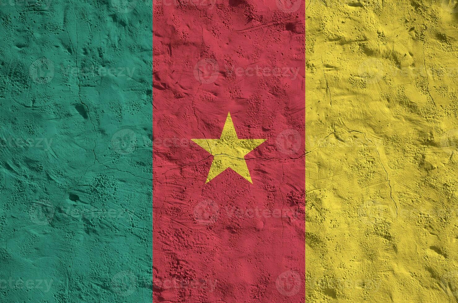 Cameroon flag depicted in bright paint colors on old relief plastering wall. Textured banner on rough background photo