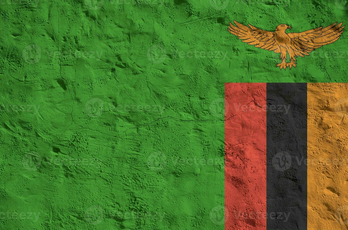 Zambia flag depicted in bright paint colors on old relief plastering wall. Textured banner on rough background photo