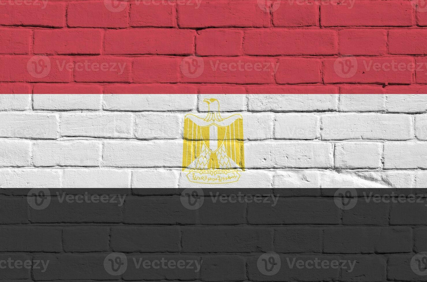 Egypt flag depicted in paint colors on old brick wall. Textured banner on big brick wall masonry background photo