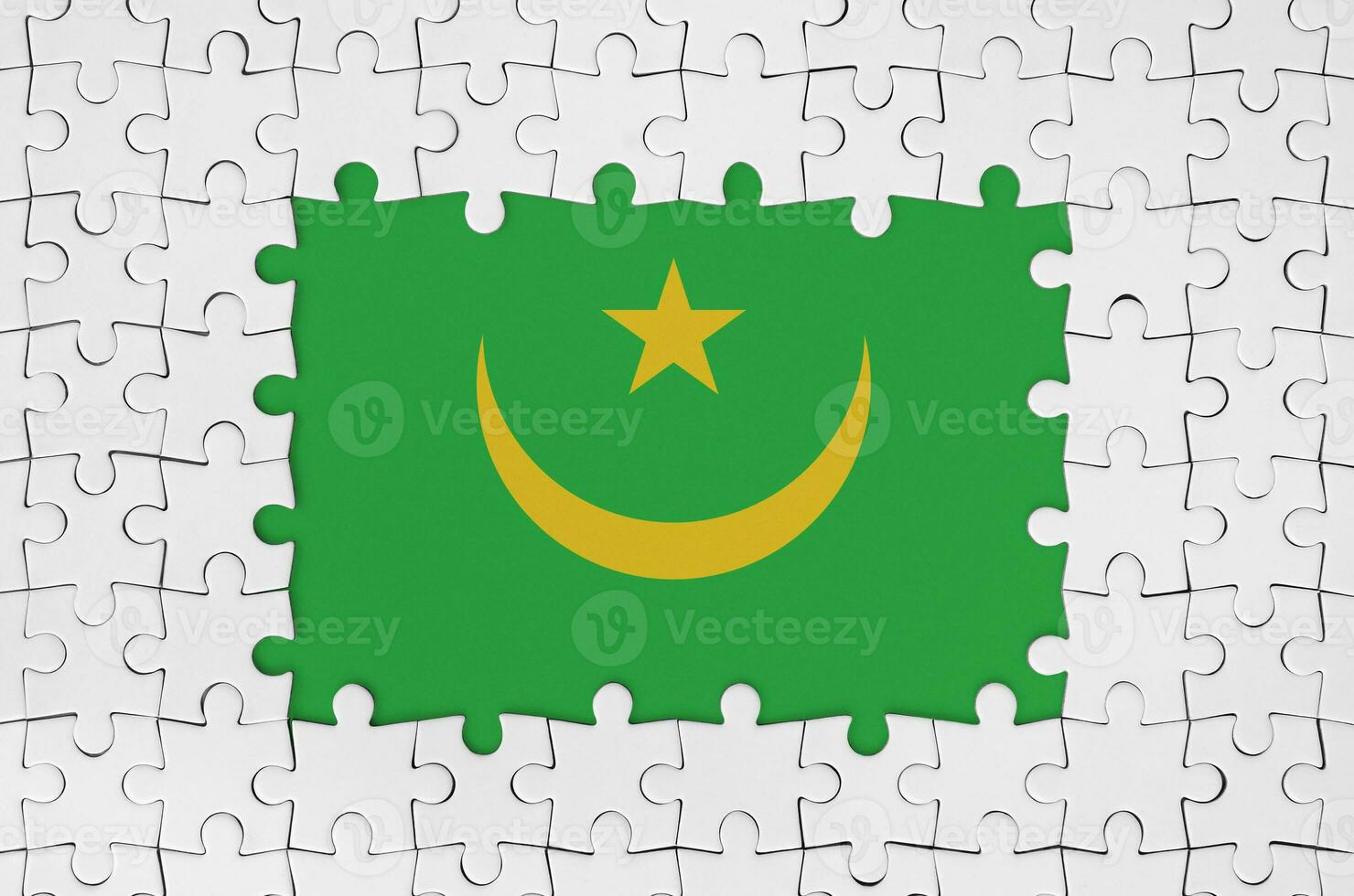 Mauritania flag in frame of white puzzle pieces with missing central part photo