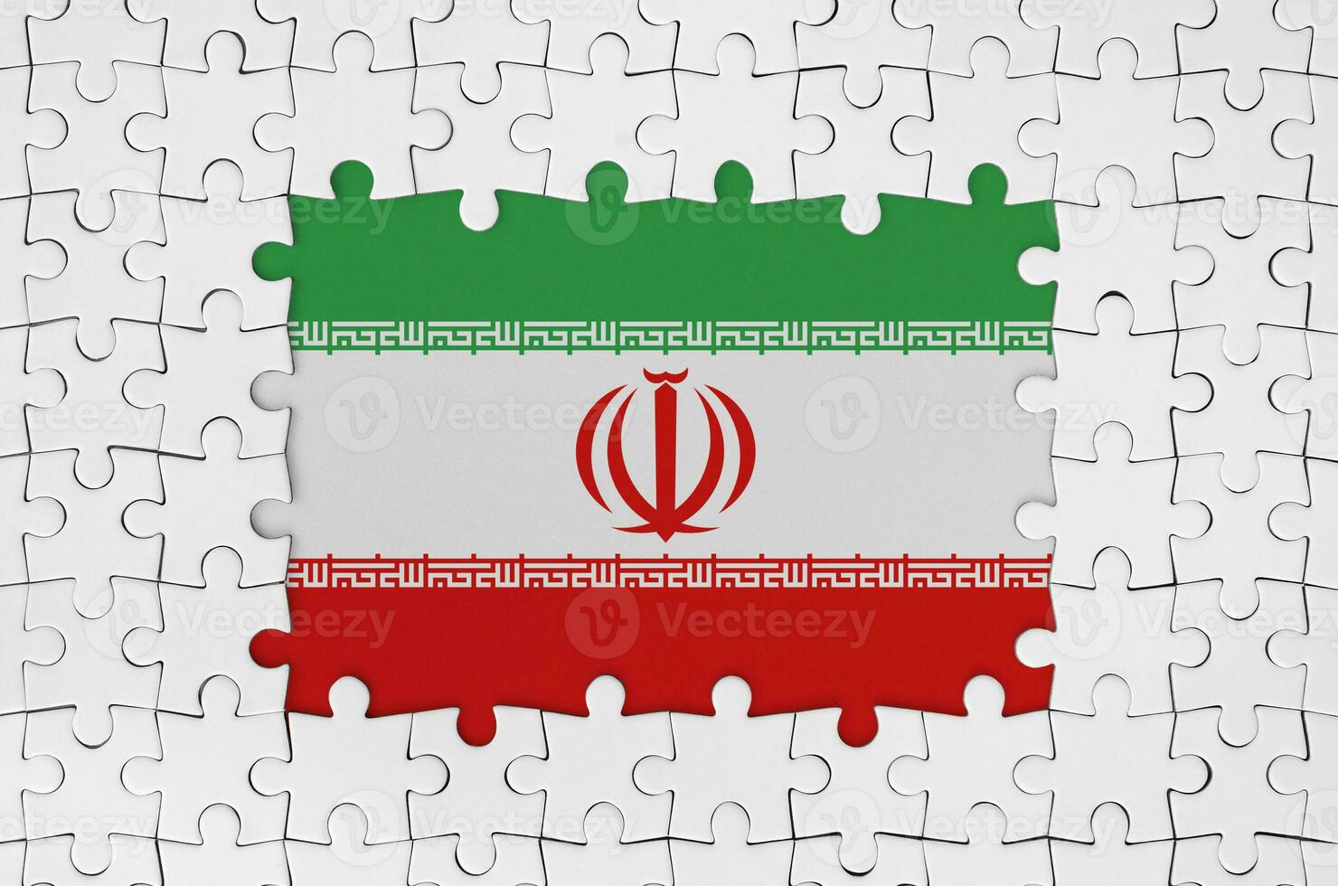 Iran flag in frame of white puzzle pieces with missing central part photo