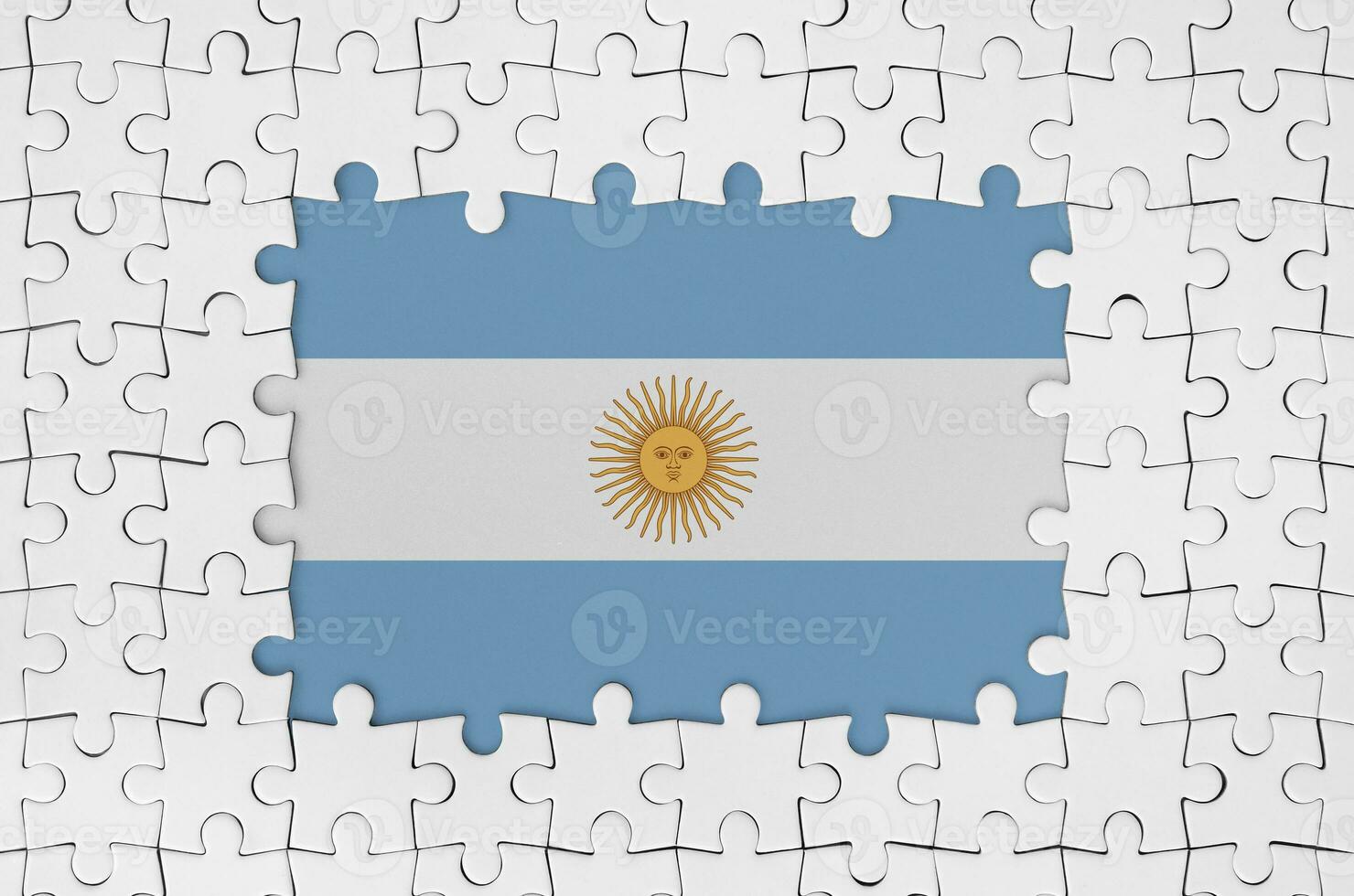Argentina flag in frame of white puzzle pieces with missing central part photo