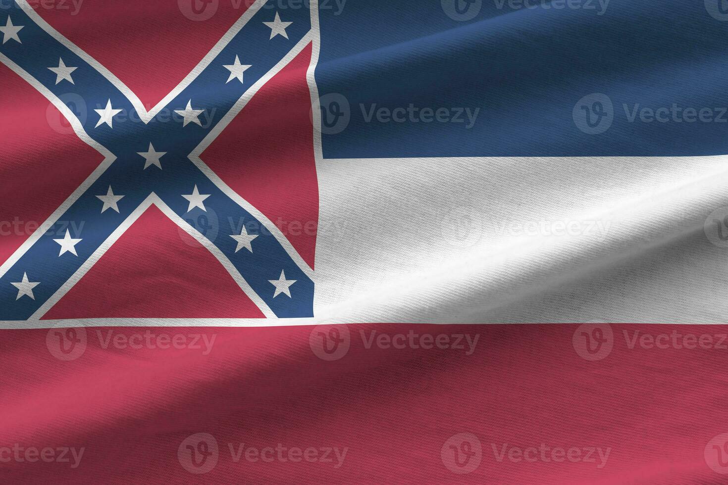 Mississippi new US state flag with big folds waving close up under the studio light indoors. The official symbols and colors in banner photo