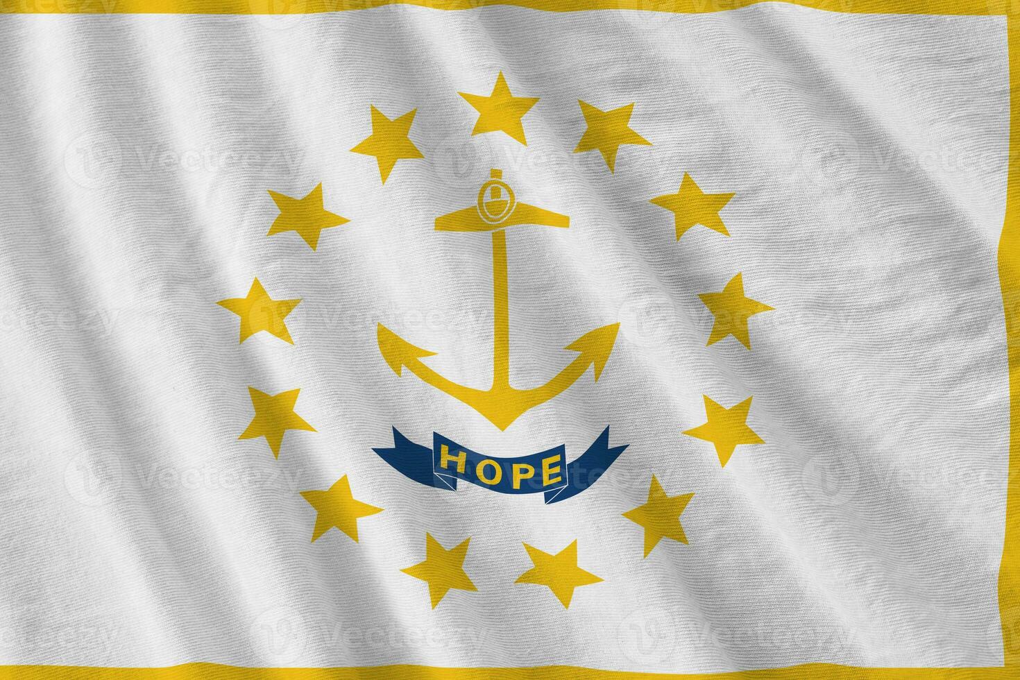 Rhode Island US state flag with big folds waving close up under the studio light indoors. The official symbols and colors in banner photo