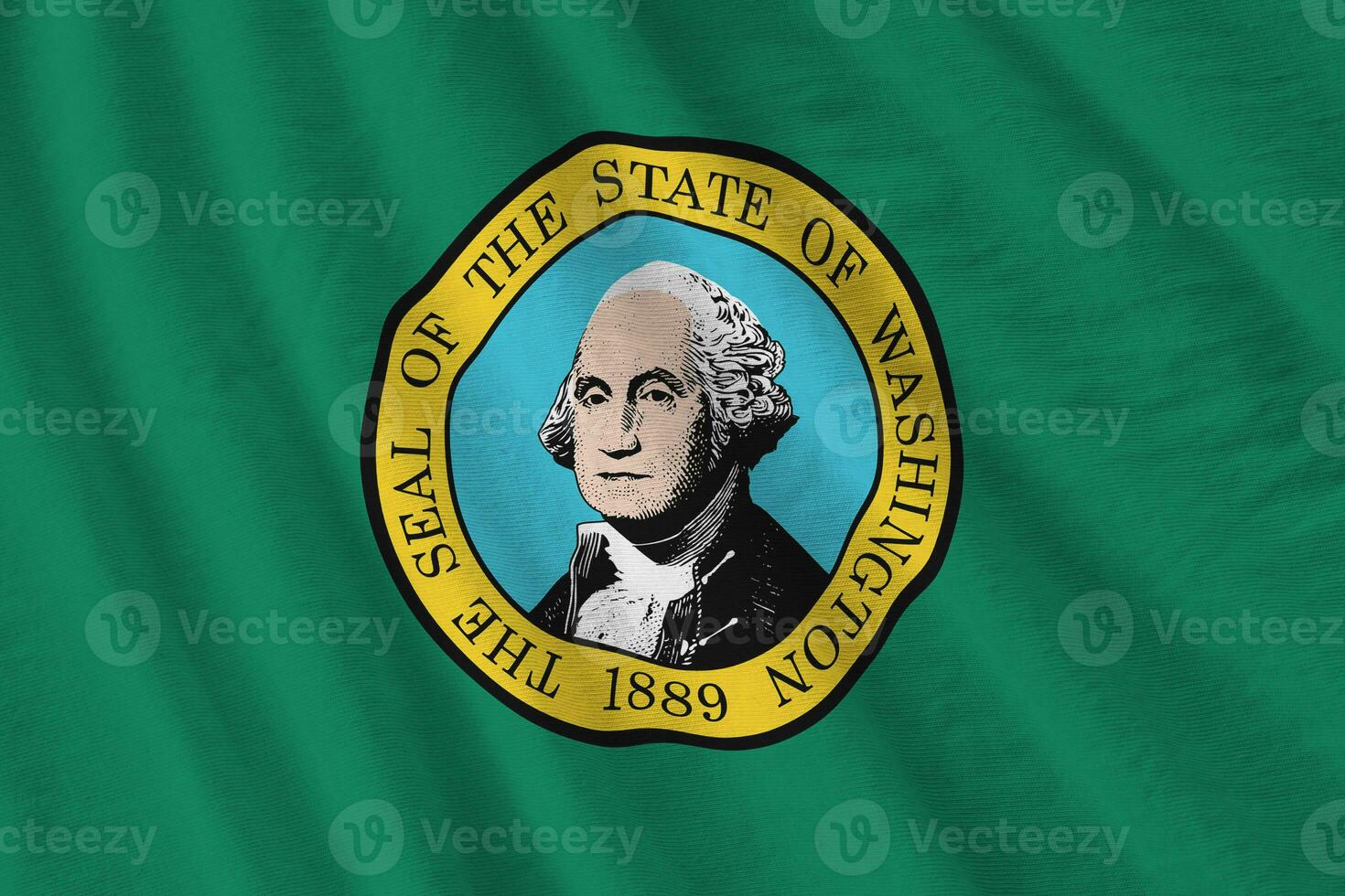Washington US state flag with big folds waving close up under the studio light indoors. The official symbols and colors in banner photo