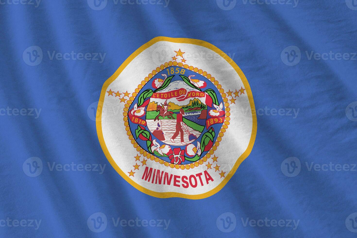Minnesota US state flag with big folds waving close up under the studio light indoors. The official symbols and colors in banner photo