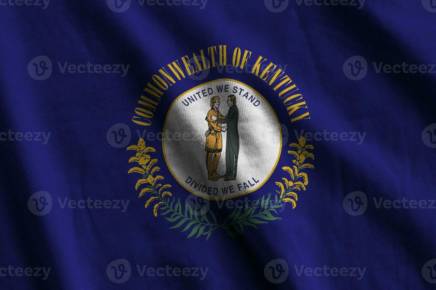 Kentucky US state flag with big folds waving close up under the studio light indoors. The official symbols and colors in banner photo